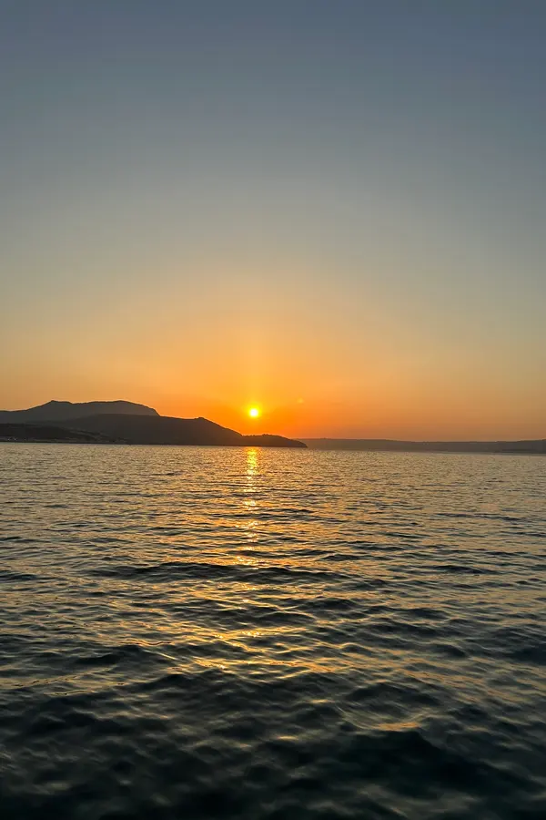 Karga island, Crete featuring traditional Cycladic architecture nestled along the dramatic coastline.